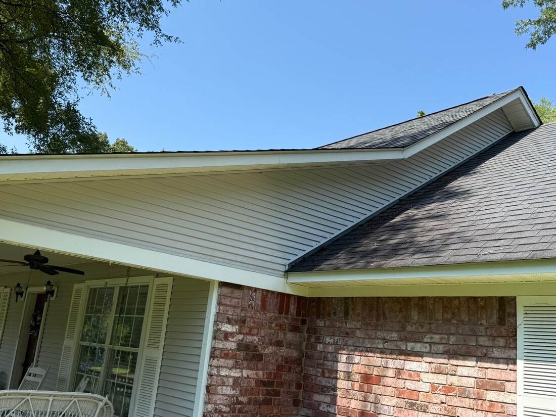 Clean soffit and brick wall on a house, after cleaning