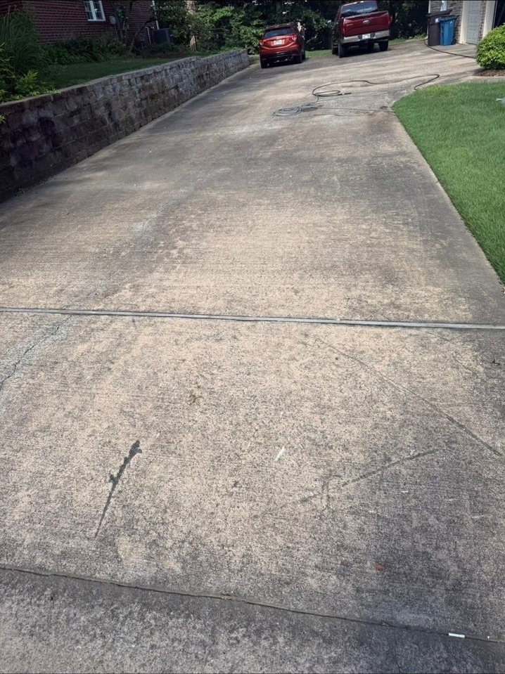 Stained driveway before pressure washing